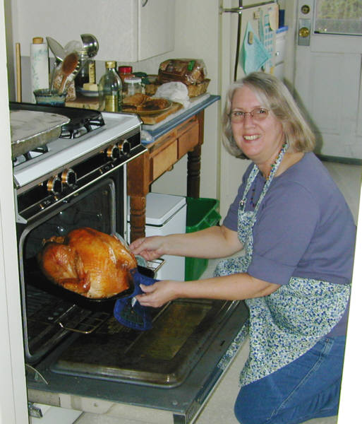 Cheryl checks the turkey.
