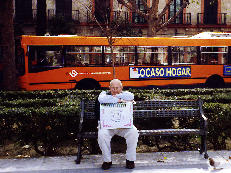 Tom holds the sewing machine in Plaza Nueva.