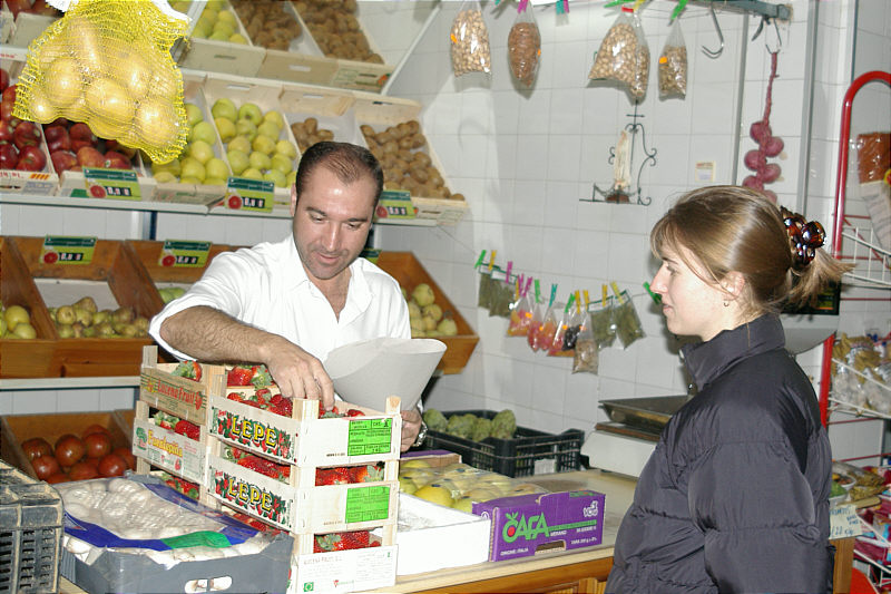 Buying strawberries at the market.