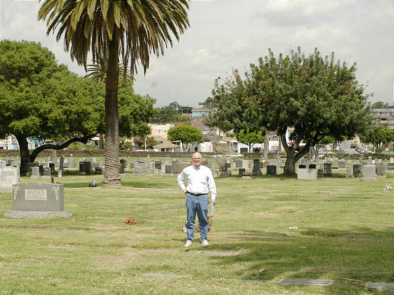 Tom just behind the graves of his grandparents, Anna and Peter Pawluk.